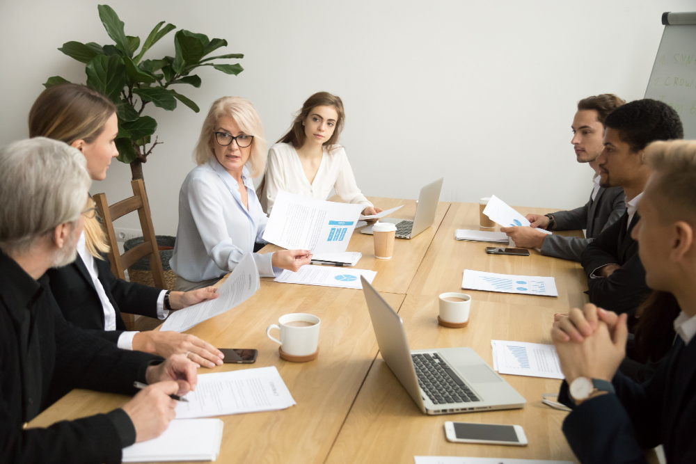 group of mixed age business people in a meeting group of mixed age business people in a meeting