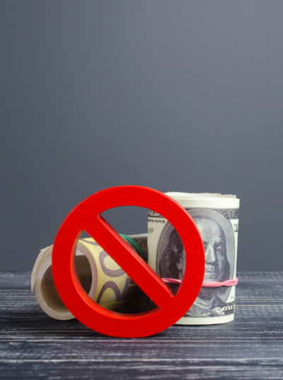 money rolled up with a drawing of a no sign (red slash in a circle) over the money to indicate no cash money rolled up with a drawing of a no sign (red slash in a circle) over the money to indicate no cash