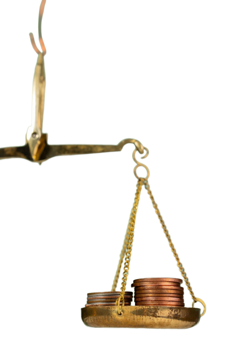 coins balancing on a scale coins balancing on a scale
